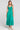 Front view of a woman wearing the Saltwater Luxe Memphis Midi Dress on a neutral background