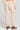 Back view of a woman wearing the Saltwater Luxe Millie Oatmeal Pant on a neutral background