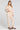 Full body front view of a woman wearing the Saltwater Luxe Millie Oatmeal Pant on a neutral background