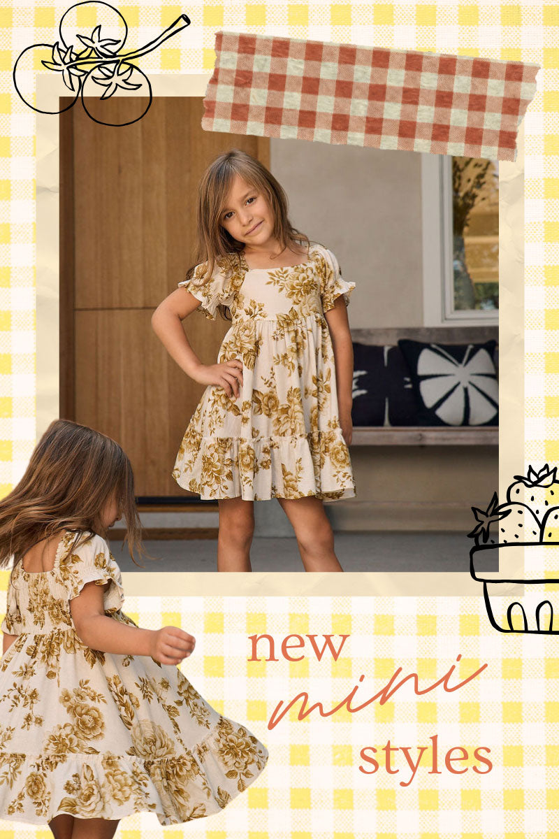 A promotional collage for a children's dress featuring a young girl wearing a cream dress with a yellow floral print in an indoor setting, plus a smaller view of the same dress from the back. The image has a yellow gingham border, decorative doodles, and the text 'new mini styles'