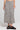 Front view of a woman wearing the Saltwater Luxe Nolla Midi Skirt on a neutral background
