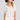 Front view of a woman wearing the Saltwater Luxe Nyomi Salt Top on a neutral background