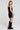 Back view of a woman wearing the Saltwater Luxe Oaklyn Midi Dress on a neutral background