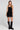 Front view of a woman wearing the Saltwater Luxe Oaklyn Midi Dress on a neutral background