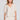 Front view of a woman wearing the Saltwater Luxe Preslee Top on a neutral background