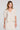 Front view of a woman wearing the Saltwater Luxe Preslee Top on a neutral background