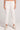 Front view of a woman wearing the Saltwater Luxe Pull On Ecru Jogger Pant on a neutral background