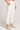 Side angle view of a woman wearing the Saltwater Luxe Pull On Ecru Jogger Pant on a neutral background