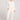 A full body front view of a woman wearing the Saltwater Luxe Pull On Ecru Jogger Pant on a neutral background