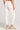 Back view of a woman wearing the Saltwater Luxe Pull On Ecru Jogger Pant on a neutral background
