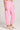 Side angle view of a woman wearing the Saltwater Luxe Pull On Petunia Jogger Pant on a neutral background