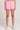 Front view of a woman wearing the Saltwater Luxe Pull On Petunia Shorts on a neutral background