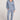 Full body front view of a woman wearing the Saltwater Luxe Pull On Worn Blue Jogger Pant on a neutral background