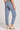 Back view of a woman wearing the Saltwater Luxe Pull On Worn Blue Jogger Pant on a neutral background