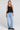 A full body front view of a woman wearing the Saltwater Luxe Quinley Black Tank on a neutral background
