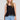 Front view of a woman wearing the Saltwater Luxe Quinley Black Tank on a neutral background