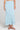 Front view of a woman wearing the Saltwater Luxe  Rainer Midi Skirt in Azure Blue on a neutral background