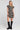 Front view of a woman wearing the Saltwater Luxe Raleigh Mini Dress on a neutral background