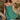 Front view of a woman wearing the Saltwater Luxe Renoa Mini Dress on a rocky beach