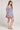 Saltwater Luxe Ventura Mini Dress in Dusty Blue Floral full body side view showing soft volume skirt and romantic silhouette