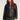Front view of woman wearing the Saltwater Luxe Vespera black faux leather jacket, zipped up,  on a plain background