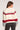 Back view of woman wearing the Saltwater Luxe patterned Revel Sweater with red, gray, and white colors on a plain background