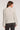 Back view of woman wearing the Saltwater Luxe Margow Sweater in Heather Grey on a plain background