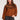 Front view of woman wearing the Saltwater Luxe brown Orson Sweater with patterned shoulders against a white background