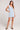 Front view of a woman wearing the Saltwater Luxe light blue Enya Skyline Mini Dress on a plain background