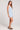 Side view of a woman wearing the Saltwater Luxe light blue Enya Skyline Mini Dress on a plain background