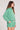 Saltwater Luxe Leyanne Pullover in Clover side view highlighting dropped shoulders soft fleece fabrication and whipstitch trim styled with matching Viva Shorts