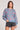 Saltwater Luxe Ronnie Sweater in Dusty Blue with pink floral pattern and ribbed trim shown from the front on a white background