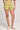 Front view of a woman wearing the Saltwater Luxe light green Arabella Willow Short on a plain background