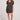 Front view of a woman wearing the Saltwater Luxe black floral Cecillia Mini Dress with black shoes on a white background