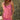 Woman wearing the Saltwater Luxe Elowena Dahlia Pink Midi Dress standing in front of green foliage