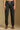 Model wearing the Saltwater Luxe Elara Black Pant with a relaxed tapered leg, front view