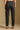 Model wearing the Saltwater Luxe Elara Black Pant with a relaxed tapered leg, back view