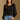 Model wearing the Saltwater Luxe Briella Black Top with a square neckline, gathered sleeves and fitted bodice, front view