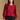 Model wearing the Saltwater Luxe Briella Crimson Top with gathered long sleeves and a back tie detail, front view