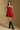 Model wearing the Saltwater Luxe Riven Mini Dress in Crimson with slim straps, front view