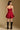 Model wearing the Saltwater Luxe Riven Mini Dress in Crimson with slim straps, full-body view