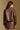 Model wearing the Saltwater Luxe Ryland Jacket in Chocolate with a pointed collar, back view