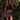 Model wearing the Saltwater Luxe Corin Mini Skirt in Chocolate showing chocolate faux-leather mini skirt, editorial view