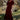 Model wearing the Saltwater Luxe Lorin Midi Dress in Burgundy with a flowing skirt, editorial view