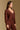 Model wearing the Saltwater Luxe Sutton Chocolate Sweater with ribbed texture, side view