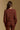 Model wearing the Saltwater Luxe Sutton Chocolate Sweater with ribbed texture, back view