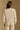 Model wearing the Saltwater Luxe Sutton Natural Sweater with ribbed texture, back view