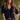 Model wearing the Saltwater Luxe Aeris Black Sweater showing black short-sleeve V-neck button-front sweater, editorial view