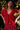 Model wearing the Saltwater Luxe Aeris Crimson Sweater showing crimson short-sleeve V-neck button-front sweater, editorial view