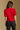 Model wearing the Saltwater Luxe Aeris Crimson Sweater showing crimson short-sleeve V-neck button-front sweater, back view